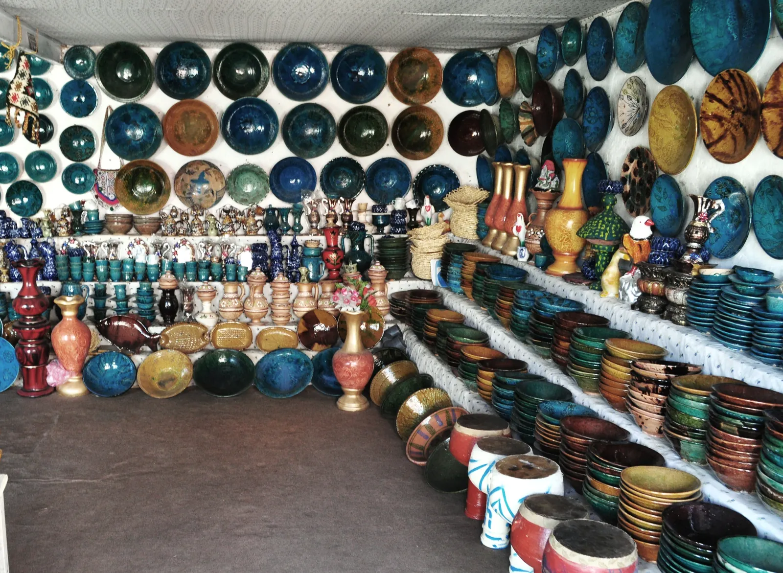 Glazed turquoise pottery on display in an Istalif shop