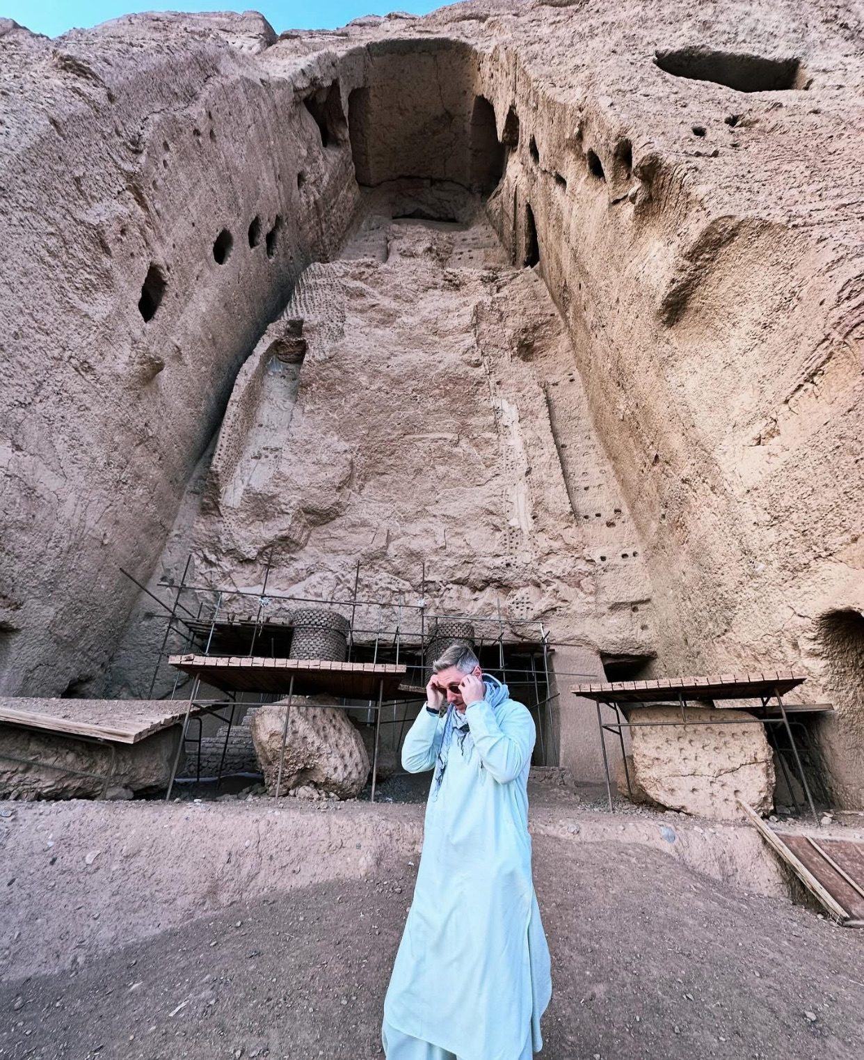 Traveler beneath the Bamyan Buddha niche