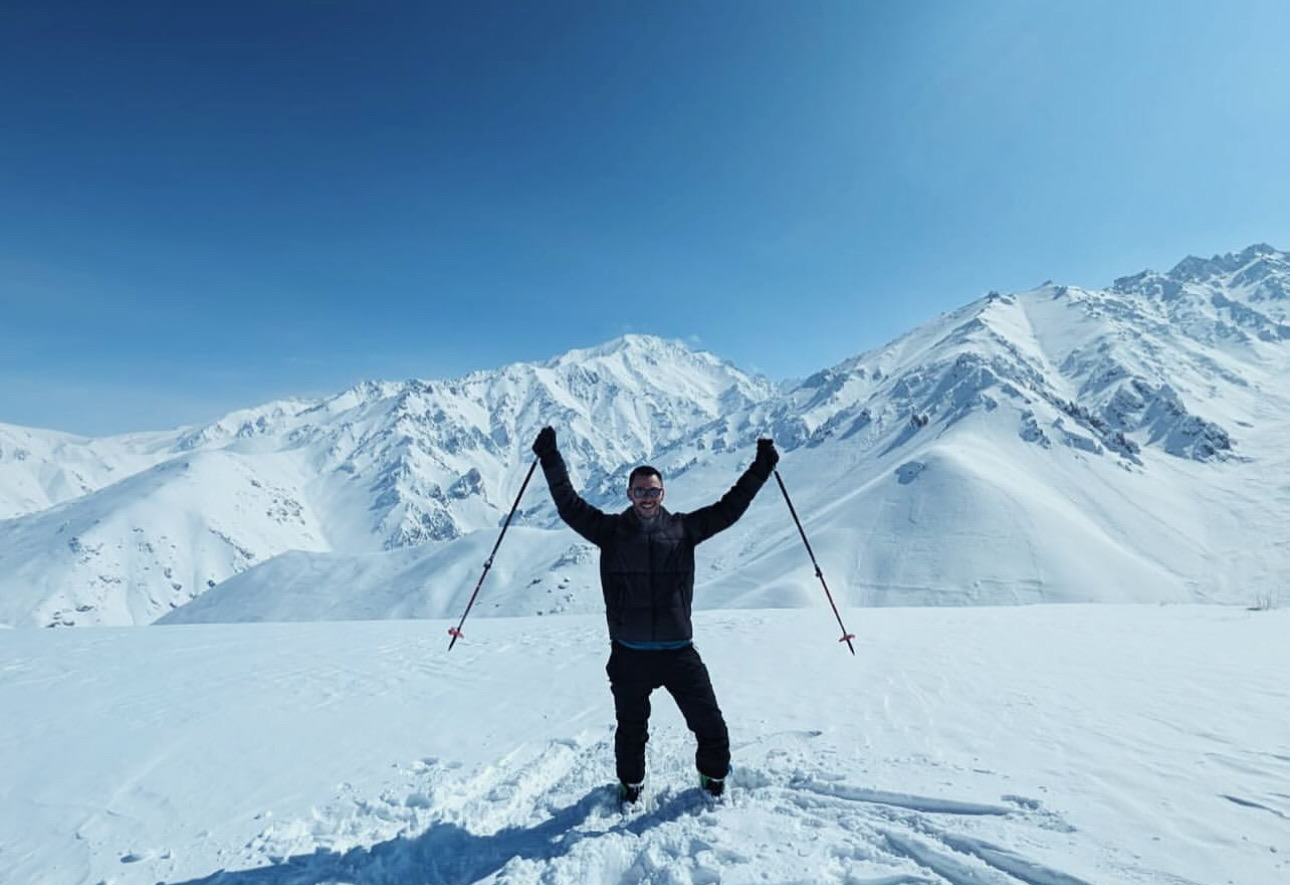 Traveler skiing in the mountains of Bamyan