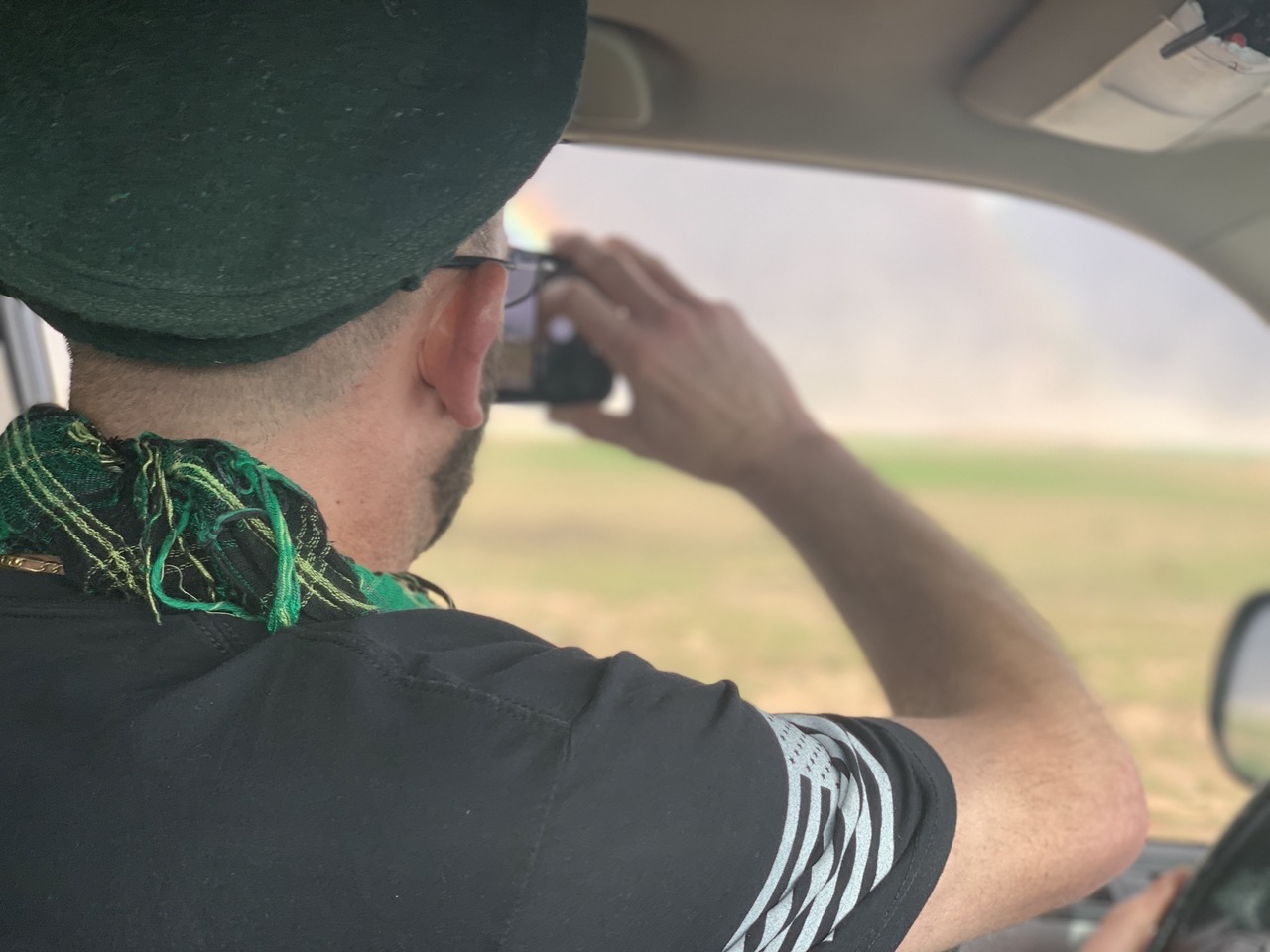 Traveler documenting Afghanistan from inside a vehicle