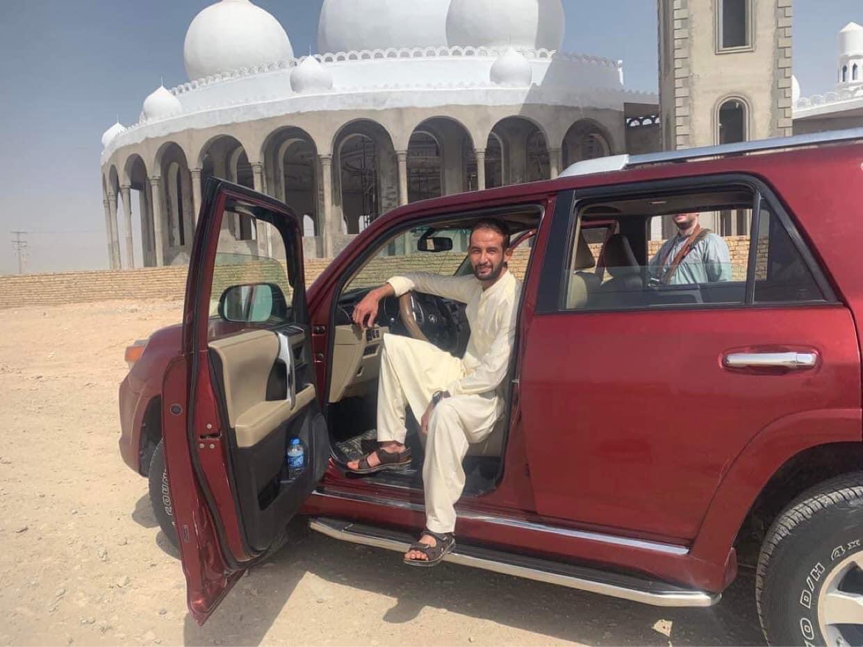 Afghan guide with a tour vehicle