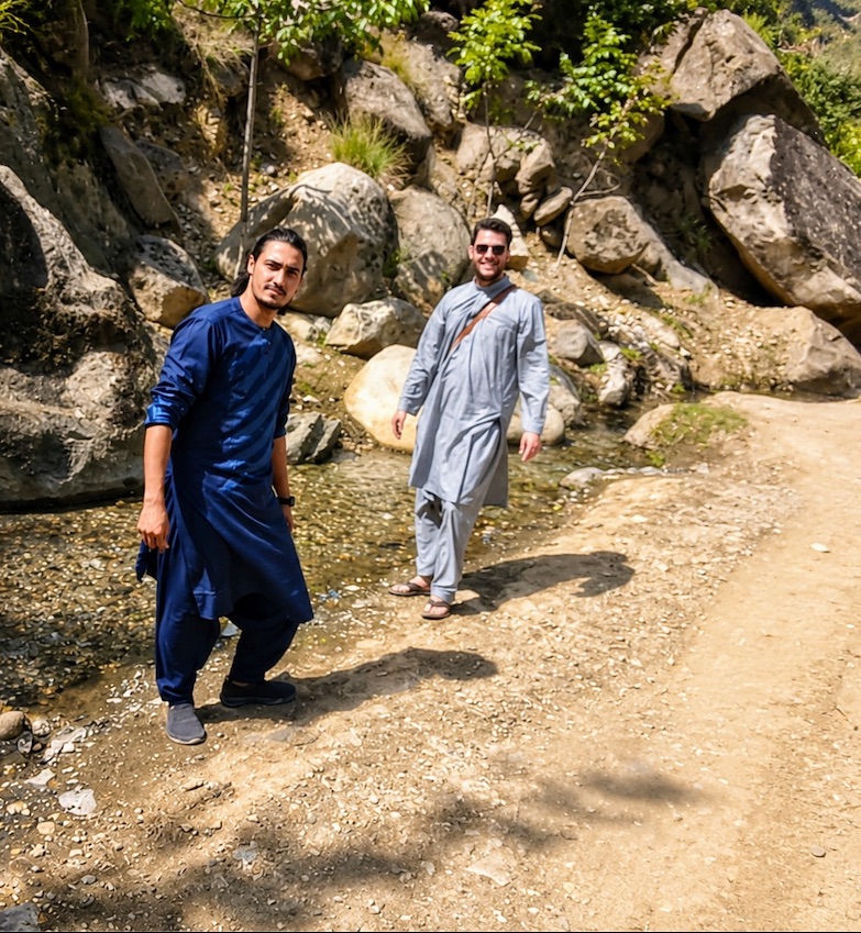 Afghan guide and traveler during a countryside stop