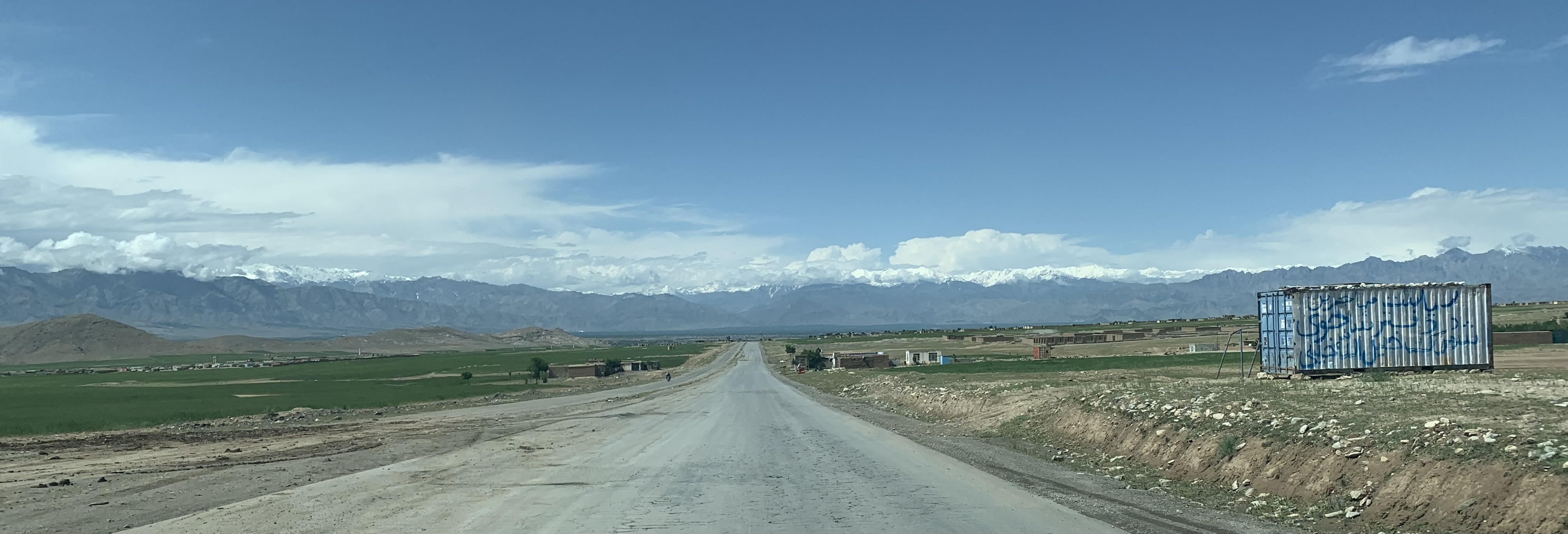Open road and mountain terrain on an Afghanistan travel route